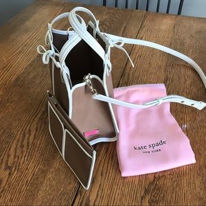 Kate Spade with wallet and pink storage bag.